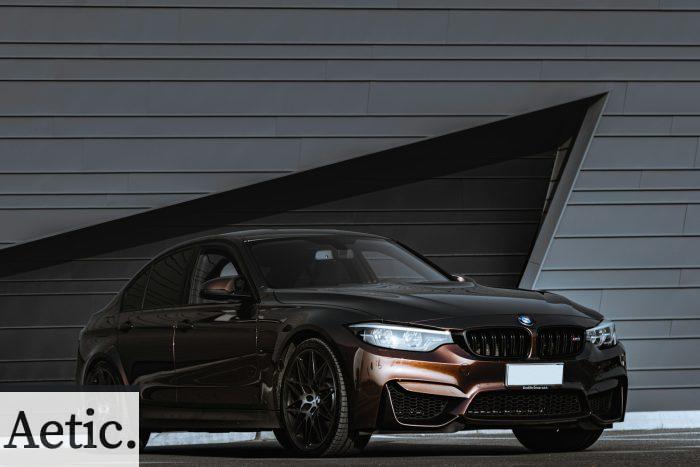 black audi a 4 coupe parked beside white wall