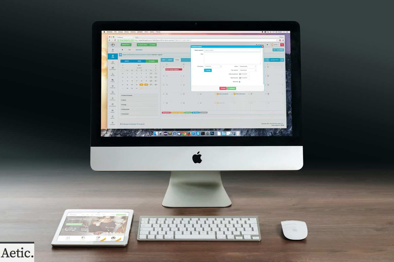 Silver Imac, Apple Magic Keyboard, and Magic Mouse on Wooden Table
