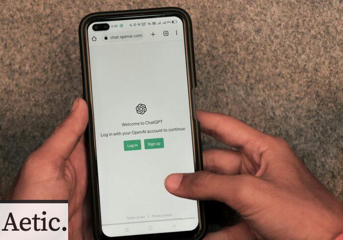 Webpage of ChatGPT, a prototype AI chatbot, is seen on the website of OpenAI, on a smartphone. Examples, capabilities, and limitations are shown.