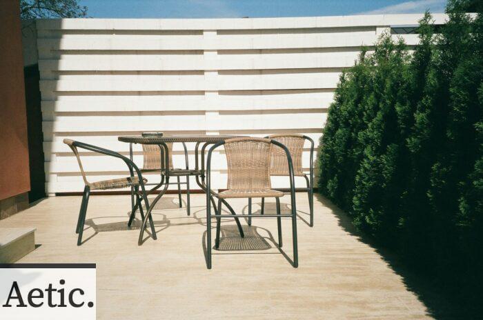 black metal framed white wooden table and chairs