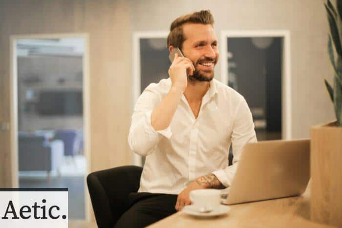 man using smartphone on chair