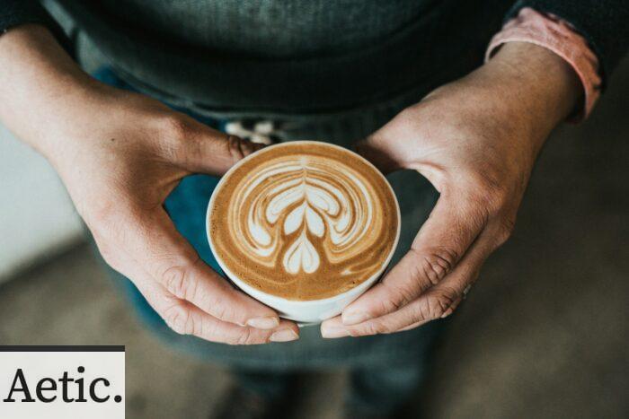 focus photography of coffee artwork