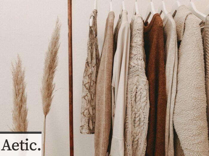 hanged top on brown and white clothes horse